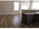 Bright eat-in kitchen with stainless steel appliances and wood floors at 5240 Sweet William St, North Las Vegas, NV 89081