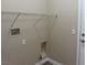 Laundry room featuring wire shelving and utility connections, ready for washer and dryer installation at 5240 Sweet William St, North Las Vegas, NV 89081