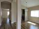 Bright and open living room featuring wood floors and arched doorways at 5240 Sweet William St, North Las Vegas, NV 89081