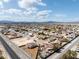 Aerial view of a residential neighborhood with mountains in the background, showcasing community and landscape at 5481 Lincolnwood Ct, Pahrump, NV 89061