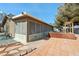 Back exterior view of a patio featuring a screened-in porch, outdoor kitchen and pergola at 5481 Lincolnwood Ct, Pahrump, NV 89061