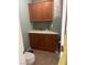 Small bathroom features a corner cabinet with a white countertop and decorative seashells at 5481 Lincolnwood Ct, Pahrump, NV 89061
