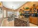 Bright eat-in kitchen features granite counters, wooden cabinets, stainless steel appliances and tile backsplash at 5481 Lincolnwood Ct, Pahrump, NV 89061