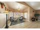 Cozy living room features a large bay window with cushioned seating, and a zebra print rug on wood floors at 5481 Lincolnwood Ct, Pahrump, NV 89061