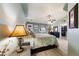 Serene main bedroom with a vaulted ceiling, ceiling fan, and a view of a walk-in closet at 5481 Lincolnwood Ct, Pahrump, NV 89061