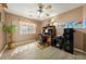 Office space features wood-style flooring, light brown walls, ceiling fan and natural light at 5481 Lincolnwood Ct, Pahrump, NV 89061