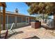 A brick patio with a built-in BBQ and a screened-in porch, perfect for outdoor entertaining at 5481 Lincolnwood Ct, Pahrump, NV 89061