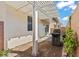 Backyard with large patio cover, neutral colored exterior, and block wall at 5667 Foxglove Field St, Las Vegas, NV 89130