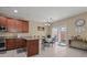 The kitchen features stainless steel appliances, granite countertops, and tile flooring at 5667 Foxglove Field St, Las Vegas, NV 89130