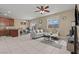 The open floor plan in the living room features neutral color scheme and tile flooring at 5667 Foxglove Field St, Las Vegas, NV 89130