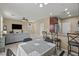 Open concept living space with tile flooring, plenty of light, and stainless steel appliances at 5667 Foxglove Field St, Las Vegas, NV 89130
