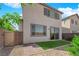 Cozy backyard with artificial turf, stone landscaping, and a secure gated entryway for added privacy and convenience at 5846 Bonita Rose St, Las Vegas, NV 89113