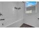 This bathroom includes a tub and shower combination with white subway tile at 5846 Bonita Rose St, Las Vegas, NV 89113