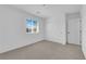 This bright bedroom includes neutral carpet, a window with blinds, and a closet at 5846 Bonita Rose St, Las Vegas, NV 89113