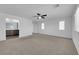 Large bedroom with carpet floors, ceiling fan, and adjoined bathroom entrance, creating a comfortable suite at 5846 Bonita Rose St, Las Vegas, NV 89113