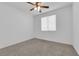Cozy bedroom with neutral carpet, ceiling fan and a bright, airy feel at 5846 Bonita Rose St, Las Vegas, NV 89113
