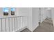 Upstairs hallway showcasing clean white walls, neutral carpet and multiple doors, offering privacy at 5846 Bonita Rose St, Las Vegas, NV 89113