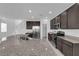 Bright kitchen boasts granite countertops, stainless steel appliances, and elegant dark wood cabinetry at 5846 Bonita Rose St, Las Vegas, NV 89113