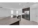 Open kitchen with granite countertops, stainless steel appliances, and a convenient island sink at 5846 Bonita Rose St, Las Vegas, NV 89113