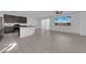 Open concept living area featuring tile flooring, a ceiling fan, and lots of natural light at 5846 Bonita Rose St, Las Vegas, NV 89113