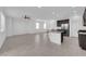 Open concept living space features a modern kitchen, tile flooring, recessed lighting and lots of windows at 5846 Bonita Rose St, Las Vegas, NV 89113