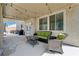 This back patio has a covered area with outdoor furniture and string lights at 6013 Aqua Blue Ct, North Las Vegas, NV 89031