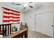 Cozy bedroom with crib, rocking chair, and striped window treatment at 6013 Aqua Blue Ct, North Las Vegas, NV 89031
