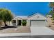 Charming single-story home featuring a well-maintained front yard and attached two-car garage at 6013 Aqua Blue Ct, North Las Vegas, NV 89031