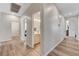 Hallway with wood-look flooring leading to bedrooms and bathroom at 6013 Aqua Blue Ct, North Las Vegas, NV 89031
