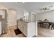 Bright kitchen features granite countertops, stainless steel appliances, and an island with dining area at 6013 Aqua Blue Ct, North Las Vegas, NV 89031