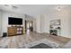 Bright living room with hardwood floors, modern furnishings, and seamless flow to other living spaces at 6013 Aqua Blue Ct, North Las Vegas, NV 89031