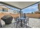 Inviting backyard featuring a covered patio, outdoor dining set, and a trampoline at 6338 Selston Dr, North Las Vegas, NV 89081