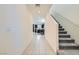 Bright foyer showcasing tile flooring and a staircase leading to the upper level at 6338 Selston Dr, North Las Vegas, NV 89081