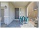 Cozy front porch with a table and chairs, offering a welcoming outdoor space at 6338 Selston Dr, North Las Vegas, NV 89081