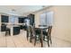 Eat-in kitchen featuring black cabinetry, granite countertops, and stainless steel appliances at 6338 Selston Dr, North Las Vegas, NV 89081