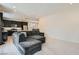 Open-concept living space featuring a comfortable sectional sofa and seamless access to the kitchen at 6338 Selston Dr, North Las Vegas, NV 89081