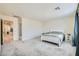 Open main bedroom with neutral carpet flooring, leading to other rooms at 6338 Selston Dr, North Las Vegas, NV 89081