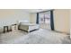 Spacious main bedroom with carpet floors, a white bed, and an abundance of natural light at 6338 Selston Dr, North Las Vegas, NV 89081