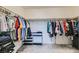 Large walk-in closet, featuring an organizational system with shelves and hanging rods at 6338 Selston Dr, North Las Vegas, NV 89081