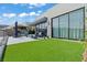 Spacious backyard featuring artificial turf and modern outdoor seating area perfect for entertaining at 650 Scenic Cliff Dr, Henderson, NV 89012