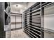 Walk-in closet with custom shelving and ample storage space at 650 Scenic Cliff Dr, Henderson, NV 89012