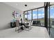 Contemporary dining room features mountain views and ample natural light at 650 Scenic Cliff Dr, Henderson, NV 89012