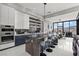 Modern kitchen with island seating, built-in oven, and stunning backyard view at 650 Scenic Cliff Dr, Henderson, NV 89012