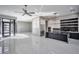 Open-concept kitchen with stainless steel appliances, marble counters, and large island at 650 Scenic Cliff Dr, Henderson, NV 89012