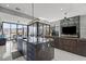 Open-concept living and kitchen with large windows and modern finishes at 650 Scenic Cliff Dr, Henderson, NV 89012