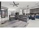 Open-concept living area with modern furnishings, a chef's kitchen, and plenty of natural light at 650 Scenic Cliff Dr, Henderson, NV 89012