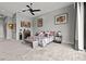 Bright main bedroom showcases neutral decor, lots of art, and a large window for plenty of natural light at 650 Scenic Cliff Dr, Henderson, NV 89012