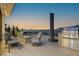 Relaxing outdoor patio area with grill, mini-fridge and a fire pit overlooking a nice view at 650 Scenic Cliff Dr, Henderson, NV 89012