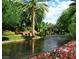 Scenic water feature with lush greenery and a charming gazebo in a serene community setting at 650 Scenic Cliff Dr, Henderson, NV 89012