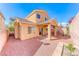 Low-maintenance backyard featuring a covered patio area, gravel landscaping, and a view of the home's exterior at 7012 Mercurio Ave, Las Vegas, NV 89131